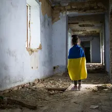 Ukrainian child in destroyed flat