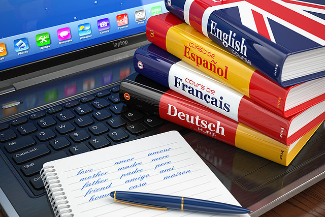 E-learning. Learning languages online. Dictionaries  on laptop.