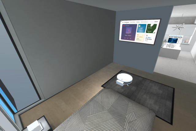Ein Schlafzimmer mit Staubsaugerroboter und Bildschirm mit intelligentem Wecker