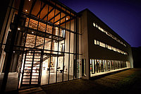 Night view of the "Aula" library building